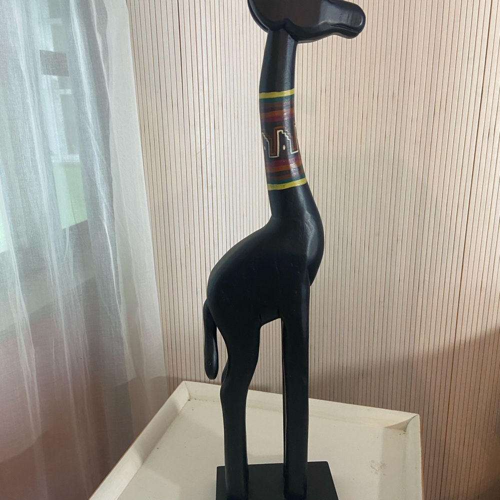 Black Wooden Giraffe Sculpture with Colorful Accents
H 21.5”.  X.  2”. X. 4”.